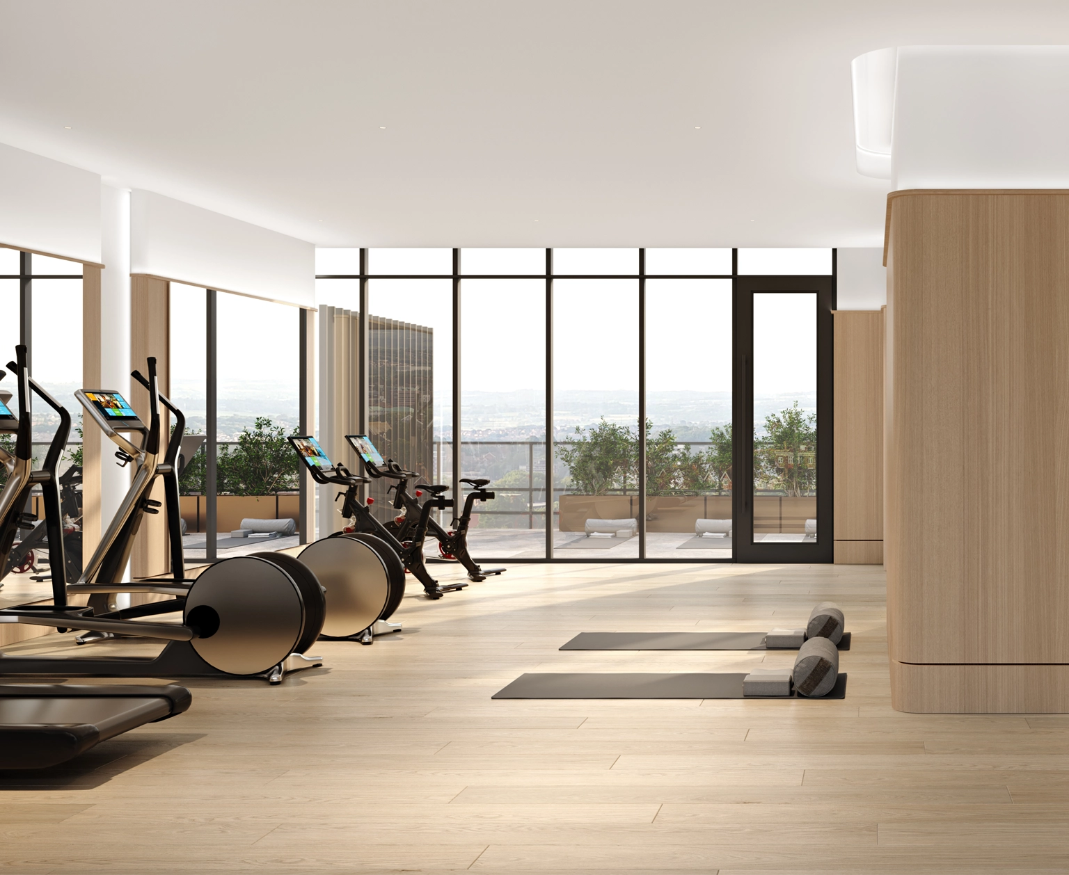 Bright natural light through large floor to ceiling windows at the boutique hotel gym with premium hardwood flooring and high-end exercise machines at The Glenhill Hotel, North York