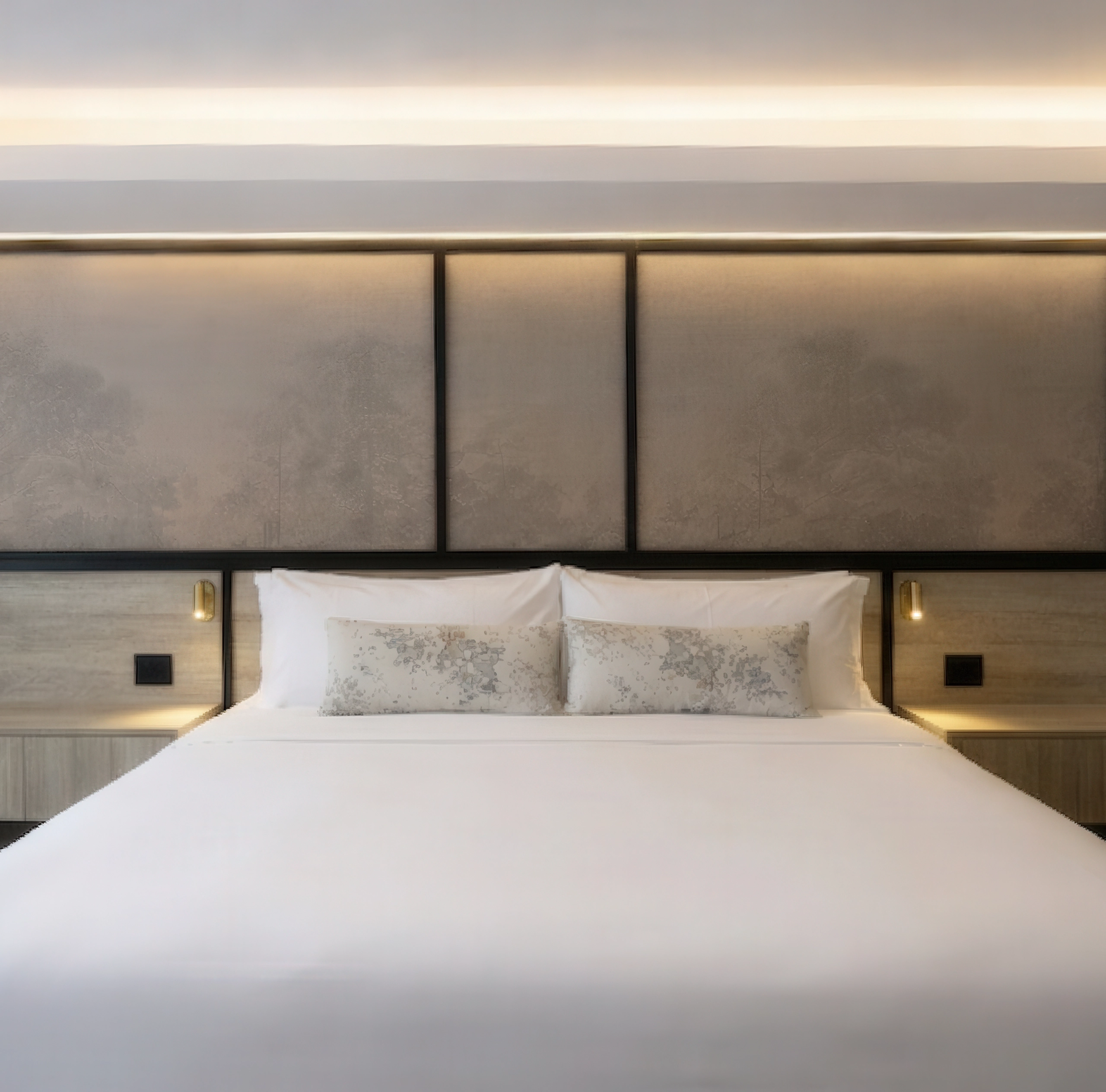 Luxury hotel suite at The Glenhill Hotel North York featuring two queen-size beds with premium white linens, high-end headboards, and elegant boutique finishes