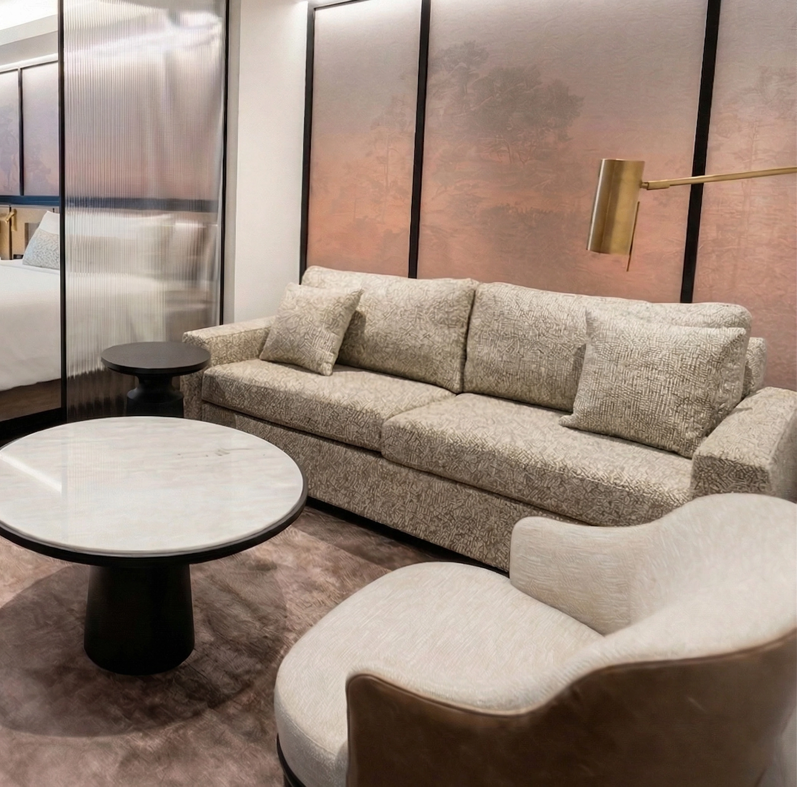 Luxury hotel suite at The Glenhill Hotel North York featuring two queen-size beds with premium white linens, high-end headboards, and elegant boutique finishes