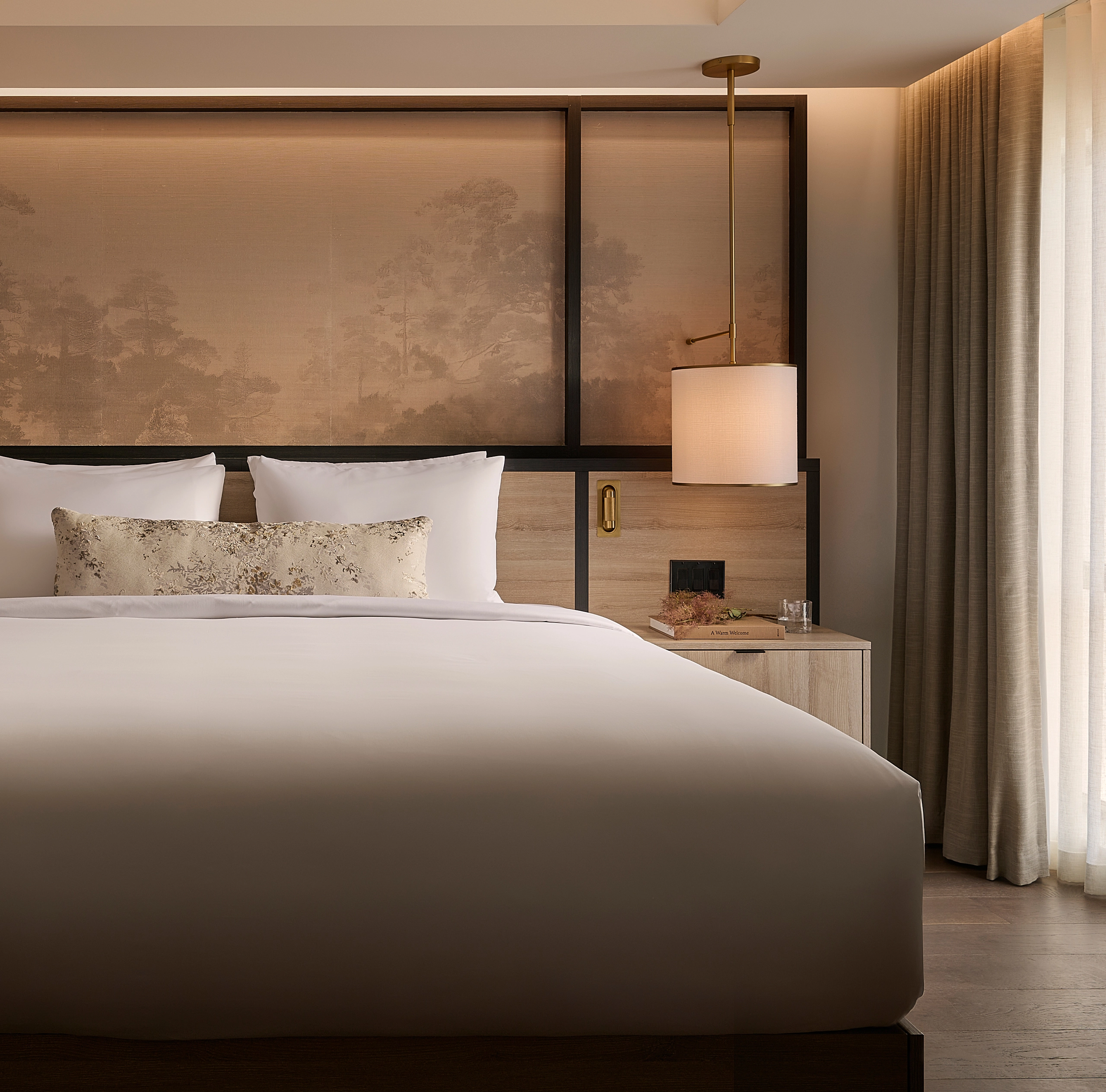 Luxury hotel suite at Glenhill Hotel in North York with a King bed and premium white linens, a high-end headboard, and elegant boutique finishes
