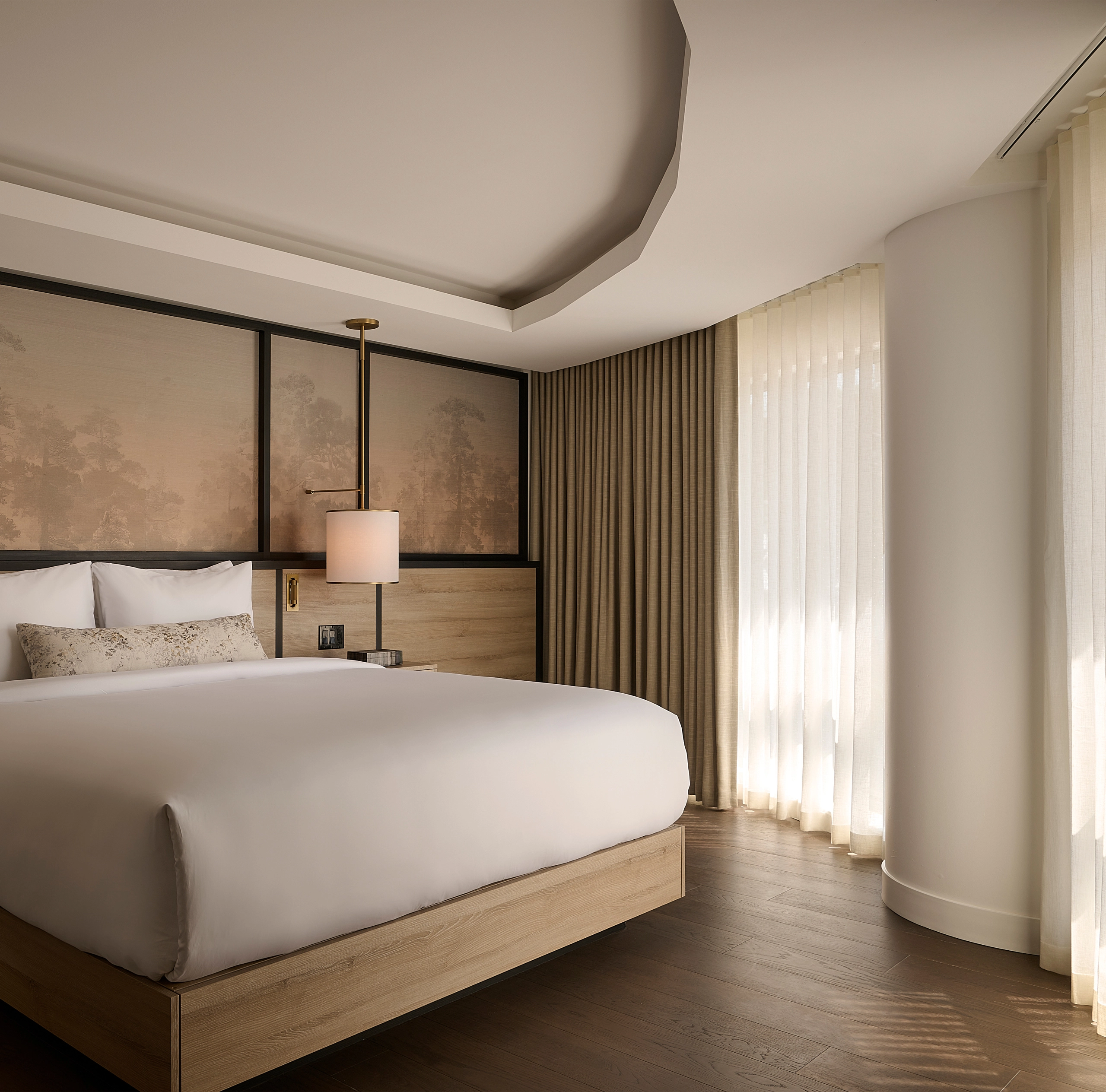 Luxury hotel suite at Glenhill Hotel in North York with a King bed and premium white linens, a high-end headboard, and elegant boutique finishes