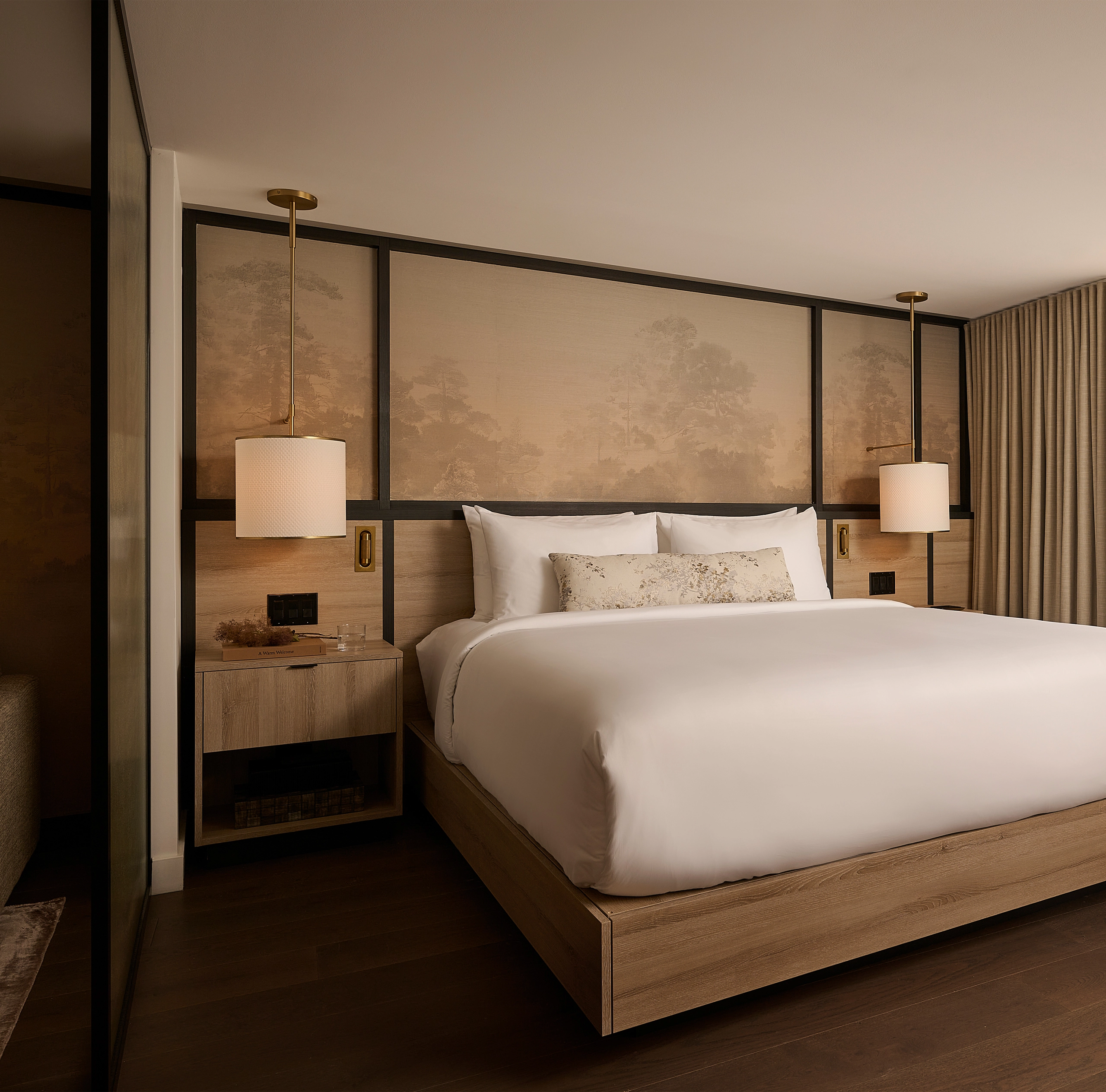 Luxury hotel suite at Glenhill Hotel in North York with a King bed and premium white linens, a high-end headboard, and elegant boutique finishes